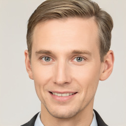 Joyful white adult male with short  brown hair and grey eyes