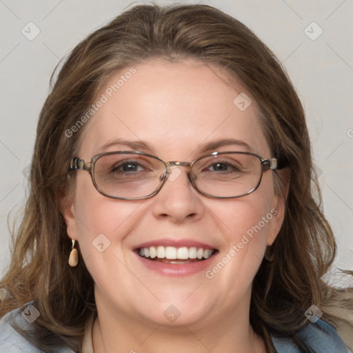 Joyful white adult female with medium  brown hair and blue eyes