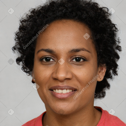 Joyful black young-adult female with short  black hair and brown eyes