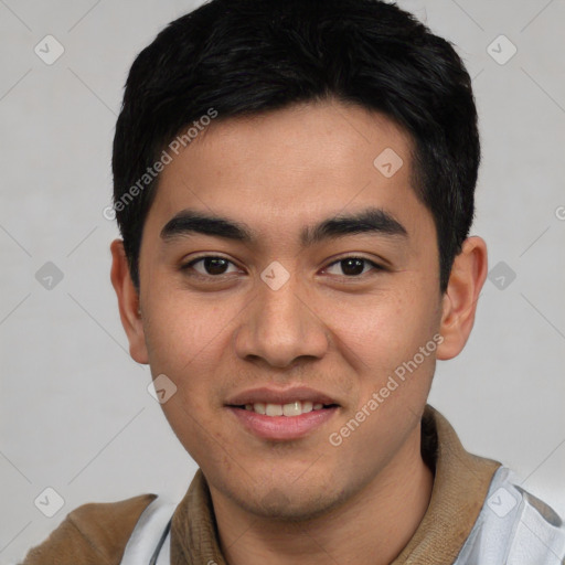 Joyful latino young-adult male with short  black hair and brown eyes