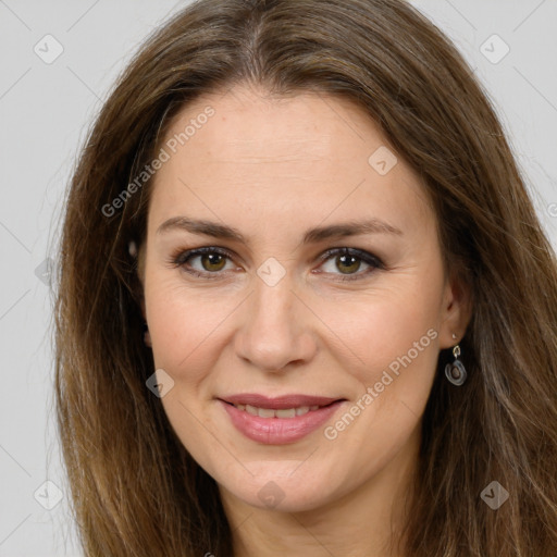 Joyful white adult female with long  brown hair and brown eyes