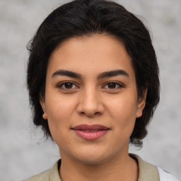 Joyful asian young-adult female with medium  brown hair and brown eyes