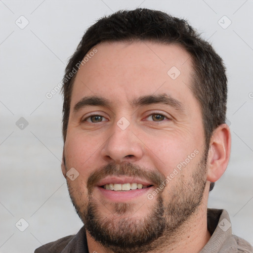 Joyful white young-adult male with short  brown hair and brown eyes