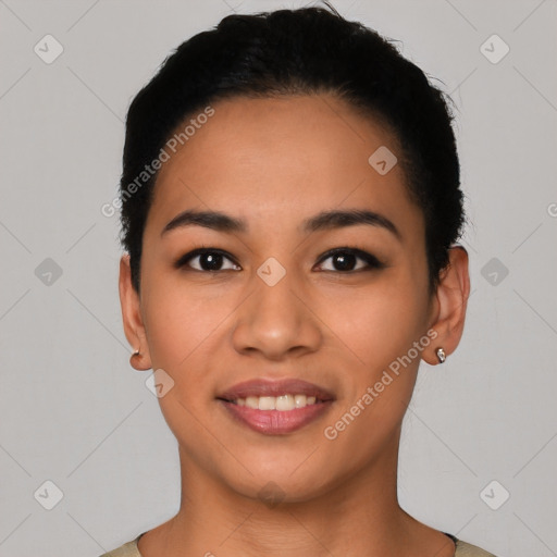 Joyful latino young-adult female with short  black hair and brown eyes