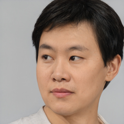 Neutral asian young-adult male with short  black hair and brown eyes
