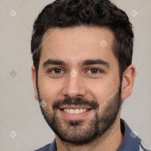 Joyful white young-adult male with short  black hair and brown eyes