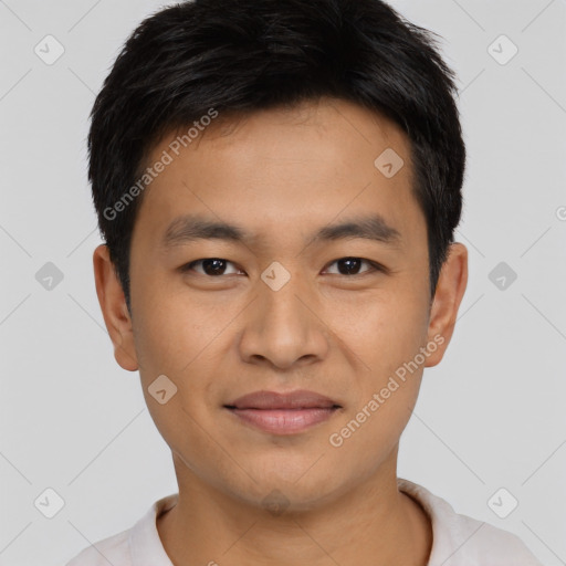 Joyful asian young-adult male with short  brown hair and brown eyes