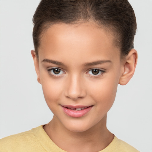 Joyful white child female with short  brown hair and brown eyes