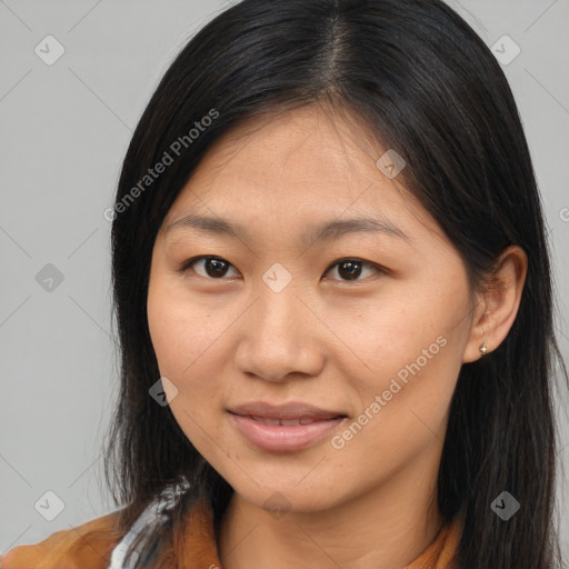 Joyful asian young-adult female with long  brown hair and brown eyes