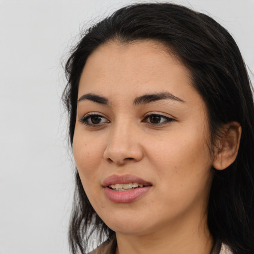 Joyful asian young-adult female with long  black hair and brown eyes