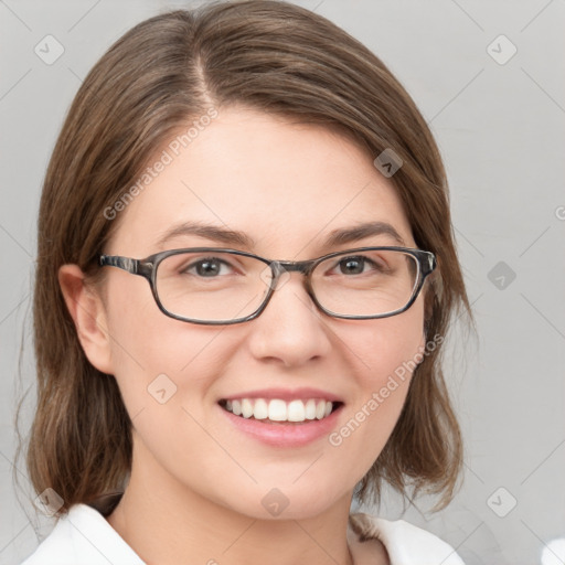 Joyful white young-adult female with medium  brown hair and green eyes