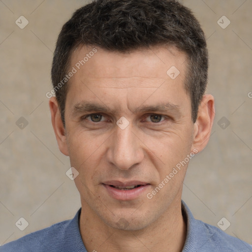 Joyful white adult male with short  brown hair and brown eyes