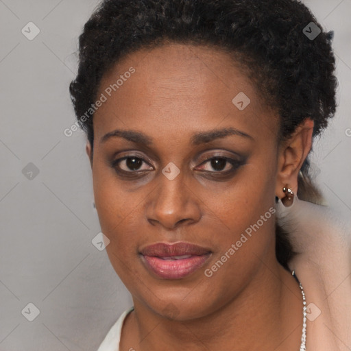 Joyful black young-adult female with short  black hair and brown eyes