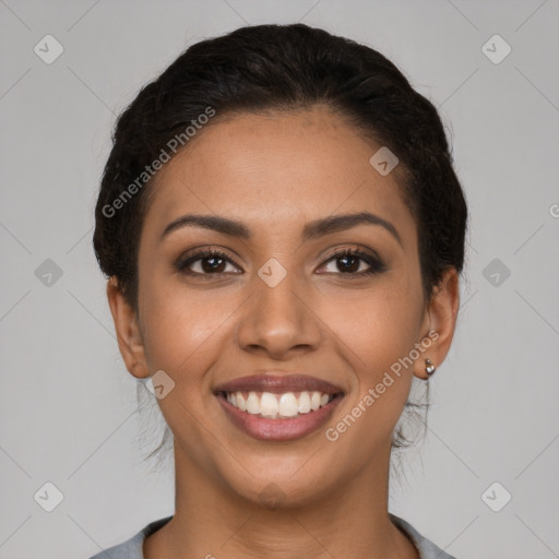 Joyful latino young-adult female with short  brown hair and brown eyes