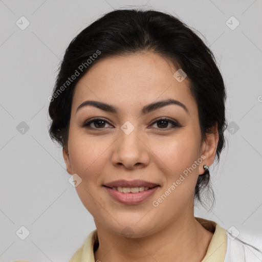 Joyful latino young-adult female with medium  brown hair and brown eyes