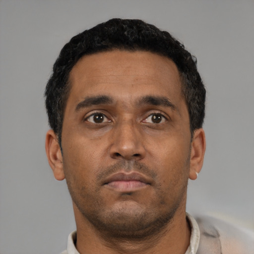 Neutral black young-adult male with short  black hair and brown eyes