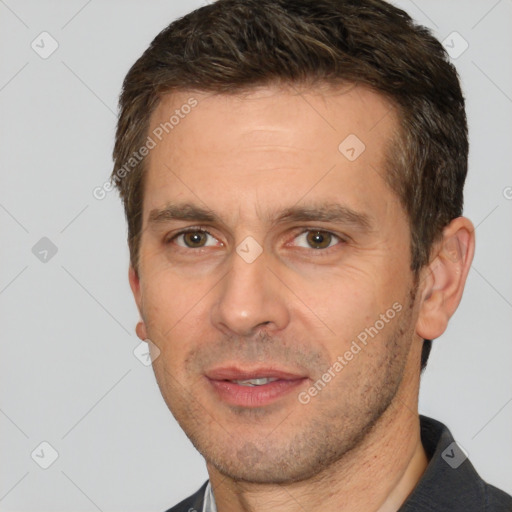 Joyful white adult male with short  brown hair and brown eyes