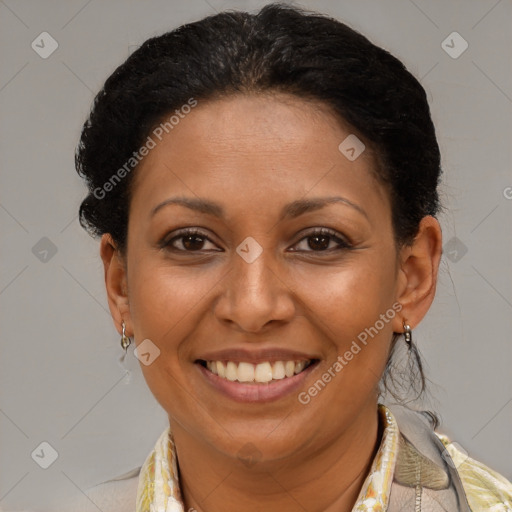 Joyful latino adult female with medium  brown hair and brown eyes