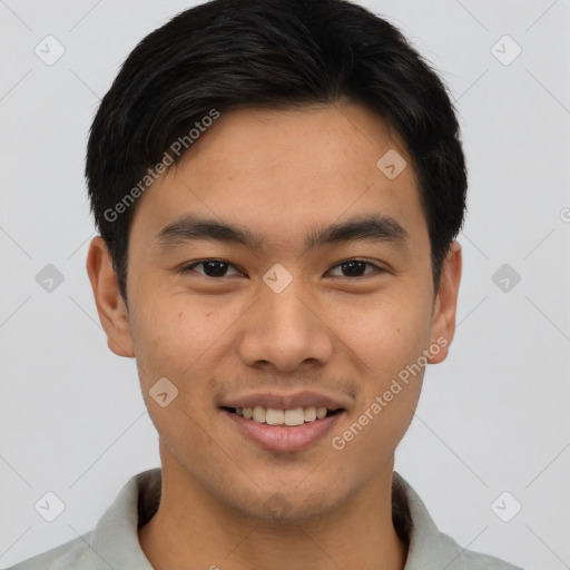 Joyful asian young-adult male with short  brown hair and brown eyes