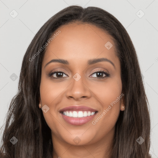 Joyful latino young-adult female with long  brown hair and brown eyes