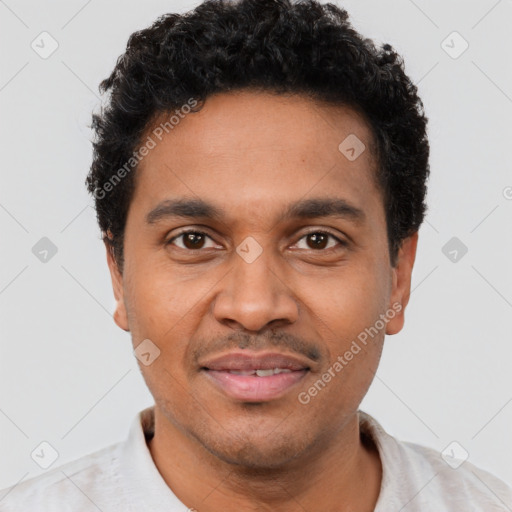 Joyful latino young-adult male with short  brown hair and brown eyes