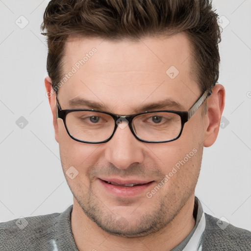 Joyful white adult male with short  brown hair and grey eyes