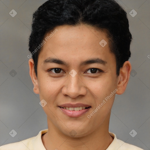 Joyful latino young-adult male with short  black hair and brown eyes