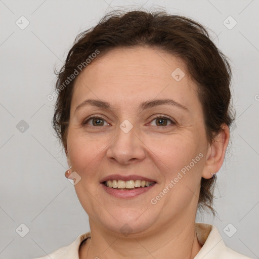 Joyful white adult female with short  brown hair and brown eyes