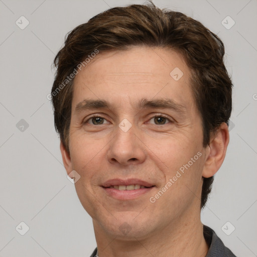 Joyful white adult male with short  brown hair and grey eyes