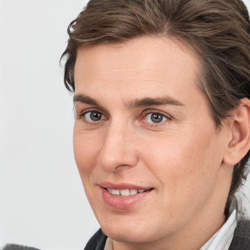 Joyful white young-adult male with medium  brown hair and brown eyes