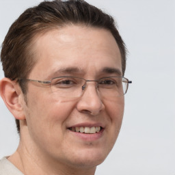 Joyful white adult male with short  brown hair and brown eyes