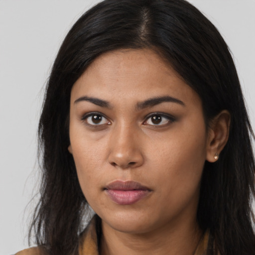 Neutral latino young-adult female with long  brown hair and brown eyes