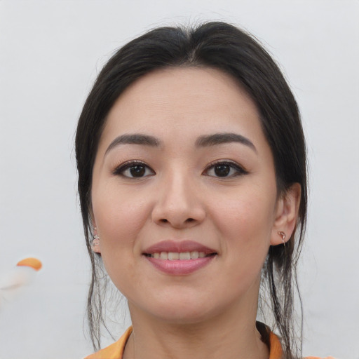 Joyful asian young-adult female with medium  brown hair and brown eyes
