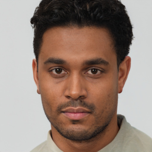 Neutral black young-adult male with short  black hair and brown eyes