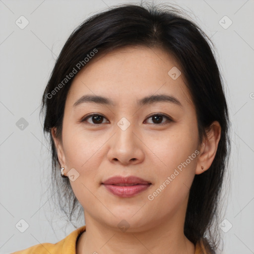 Joyful asian young-adult female with medium  brown hair and brown eyes