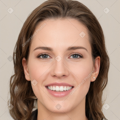 Joyful white young-adult female with long  brown hair and green eyes