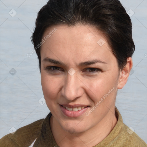 Joyful white adult female with short  brown hair and brown eyes