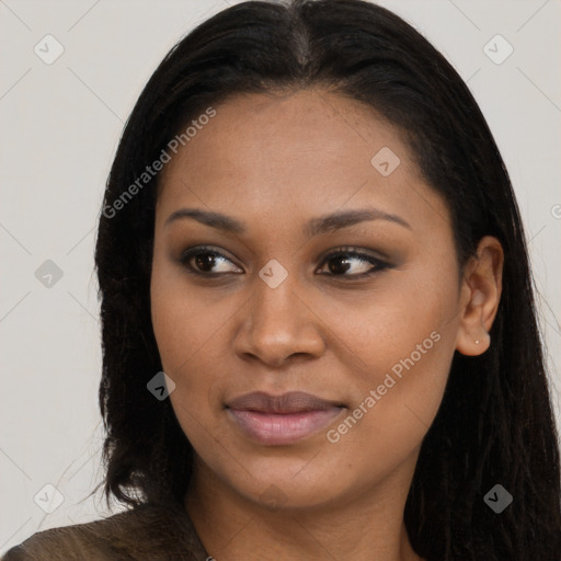 Joyful black young-adult female with long  brown hair and brown eyes