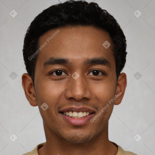 Joyful latino young-adult male with short  black hair and brown eyes