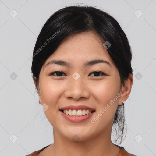 Joyful asian young-adult female with medium  black hair and brown eyes