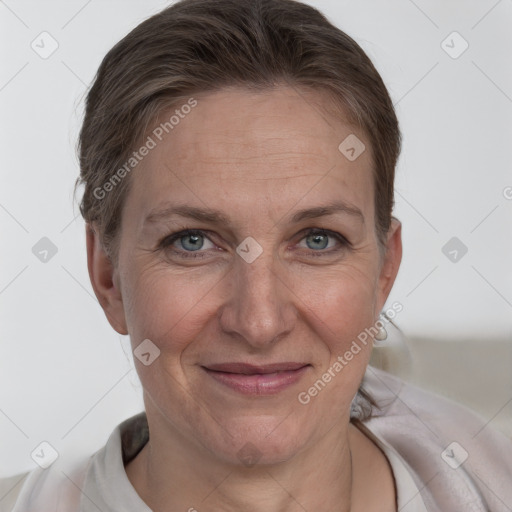 Joyful white adult female with short  brown hair and brown eyes