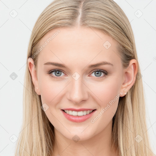 Joyful white young-adult female with long  brown hair and blue eyes