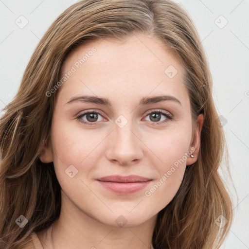 Joyful white young-adult female with long  brown hair and blue eyes