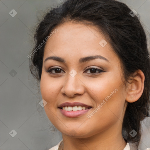 Joyful latino young-adult female with long  brown hair and brown eyes