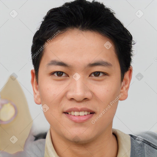 Joyful asian young-adult male with short  black hair and brown eyes