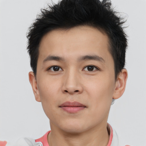 Joyful asian young-adult male with short  brown hair and brown eyes