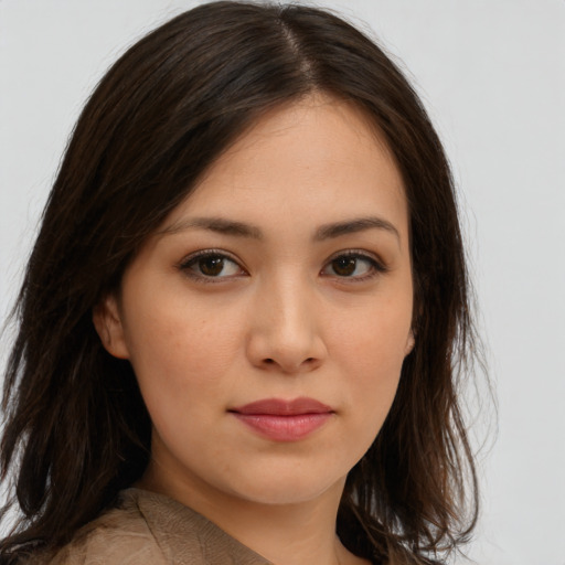 Joyful asian young-adult female with long  brown hair and brown eyes
