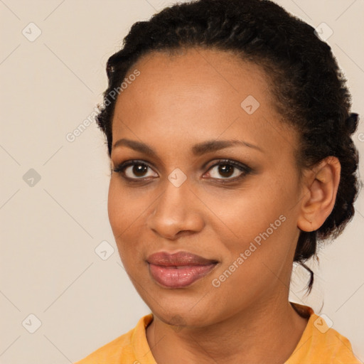 Joyful black young-adult female with short  brown hair and brown eyes