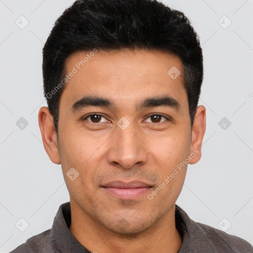 Joyful latino young-adult male with short  black hair and brown eyes