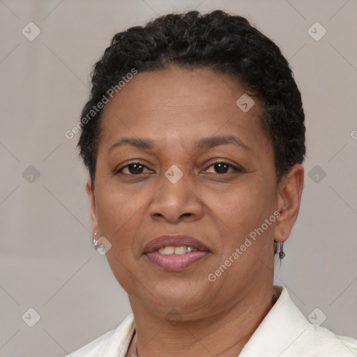 Joyful black adult female with short  brown hair and brown eyes